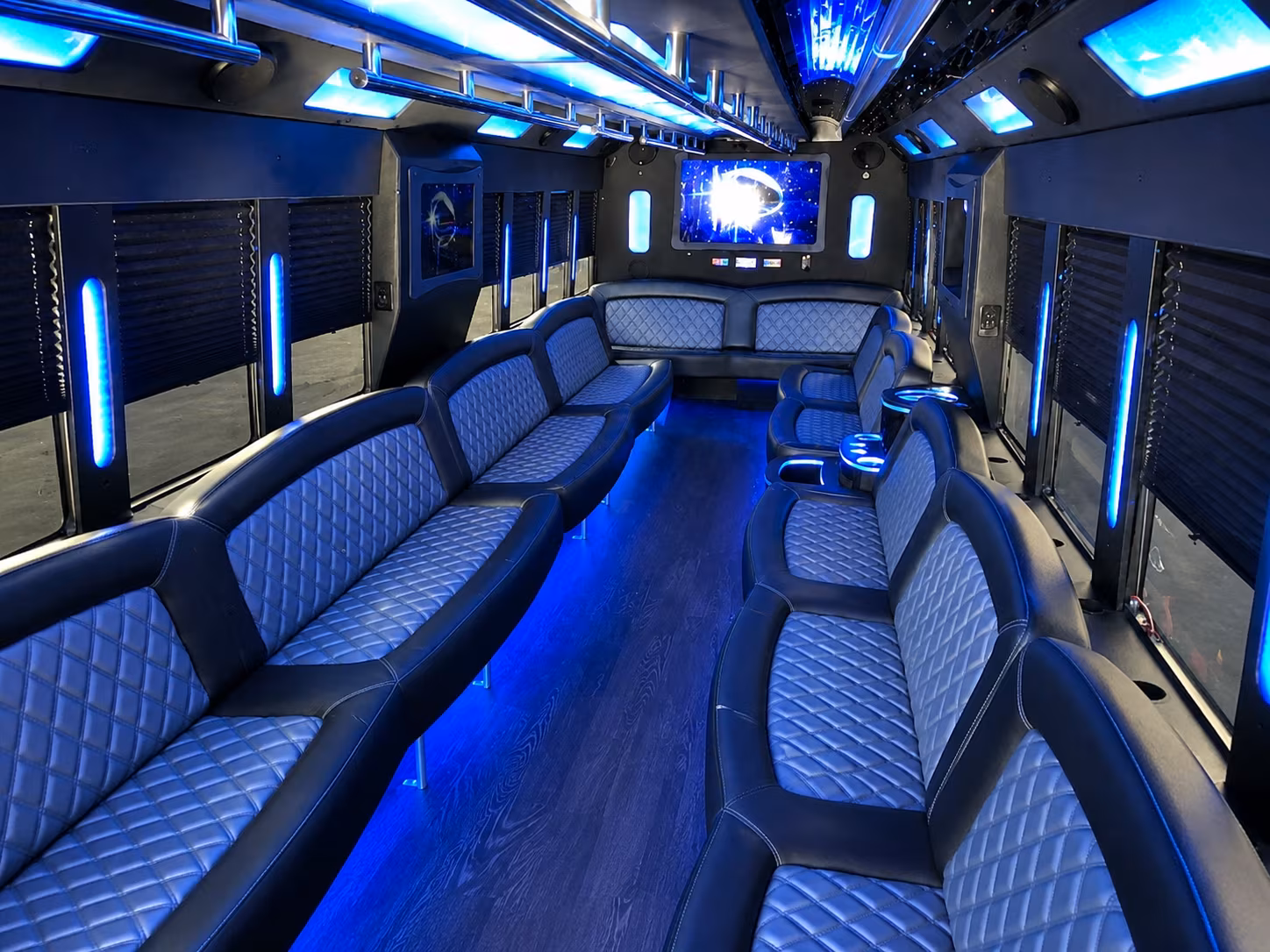 Friends laughing during a party bus celebration in Buffalo